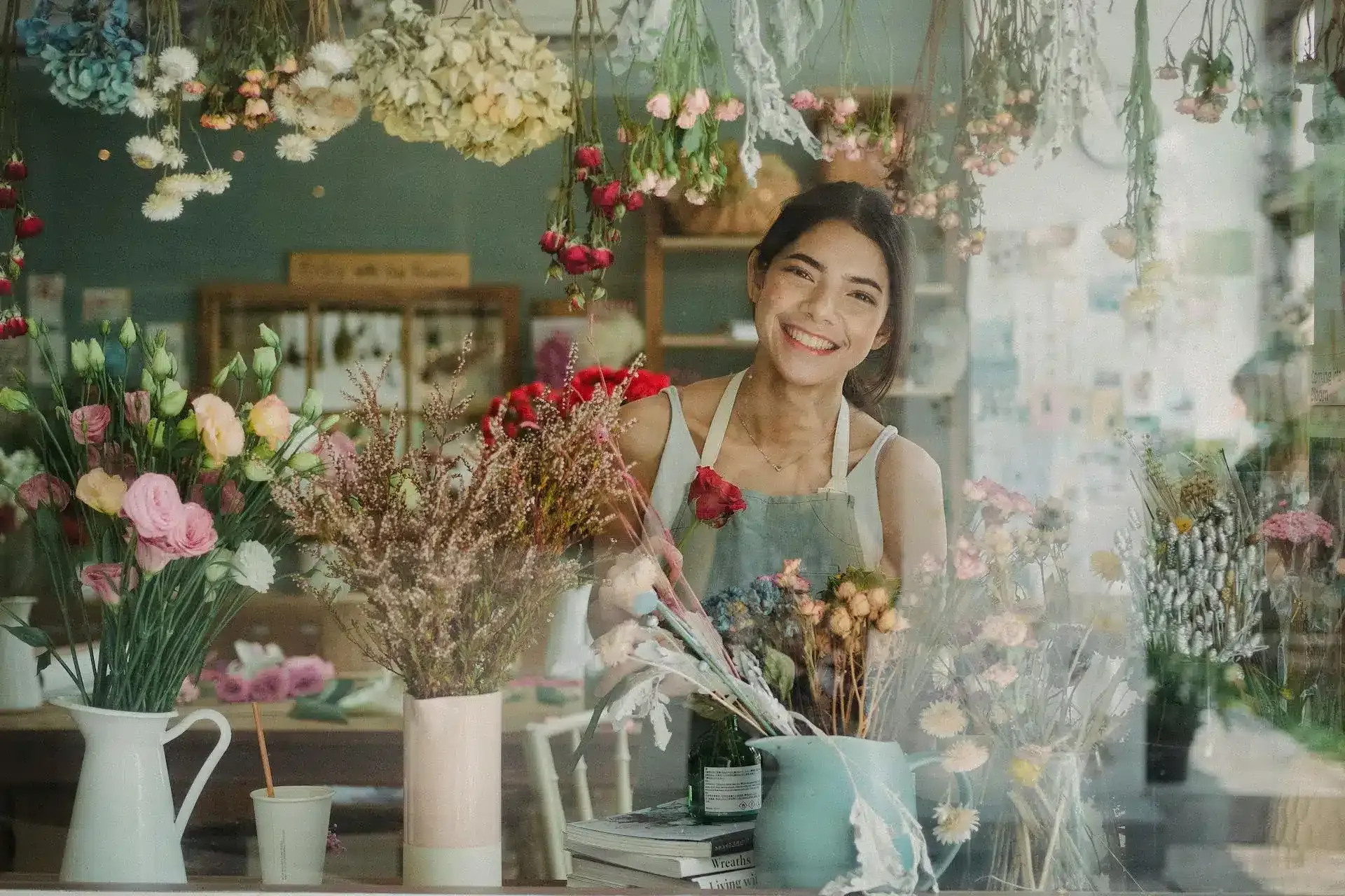Flower shop owner smiling