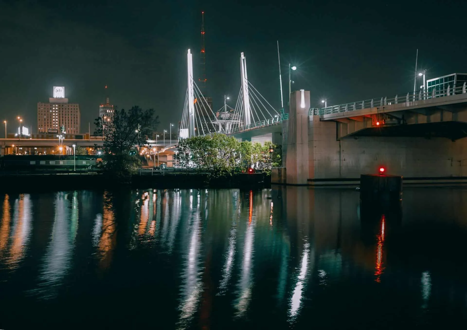 Guiding Buoys Near Bridge At Night