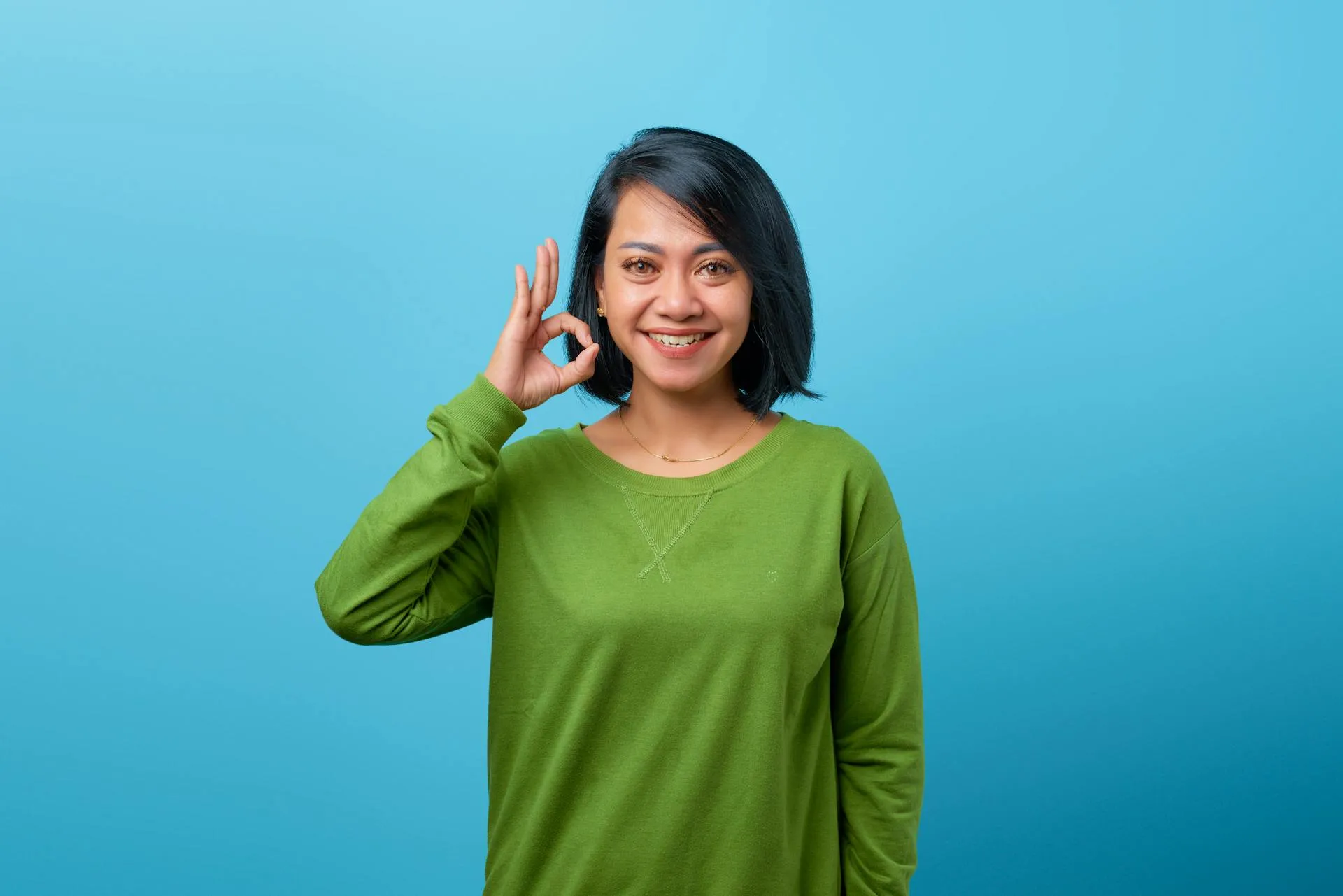 Woman making an ok sign