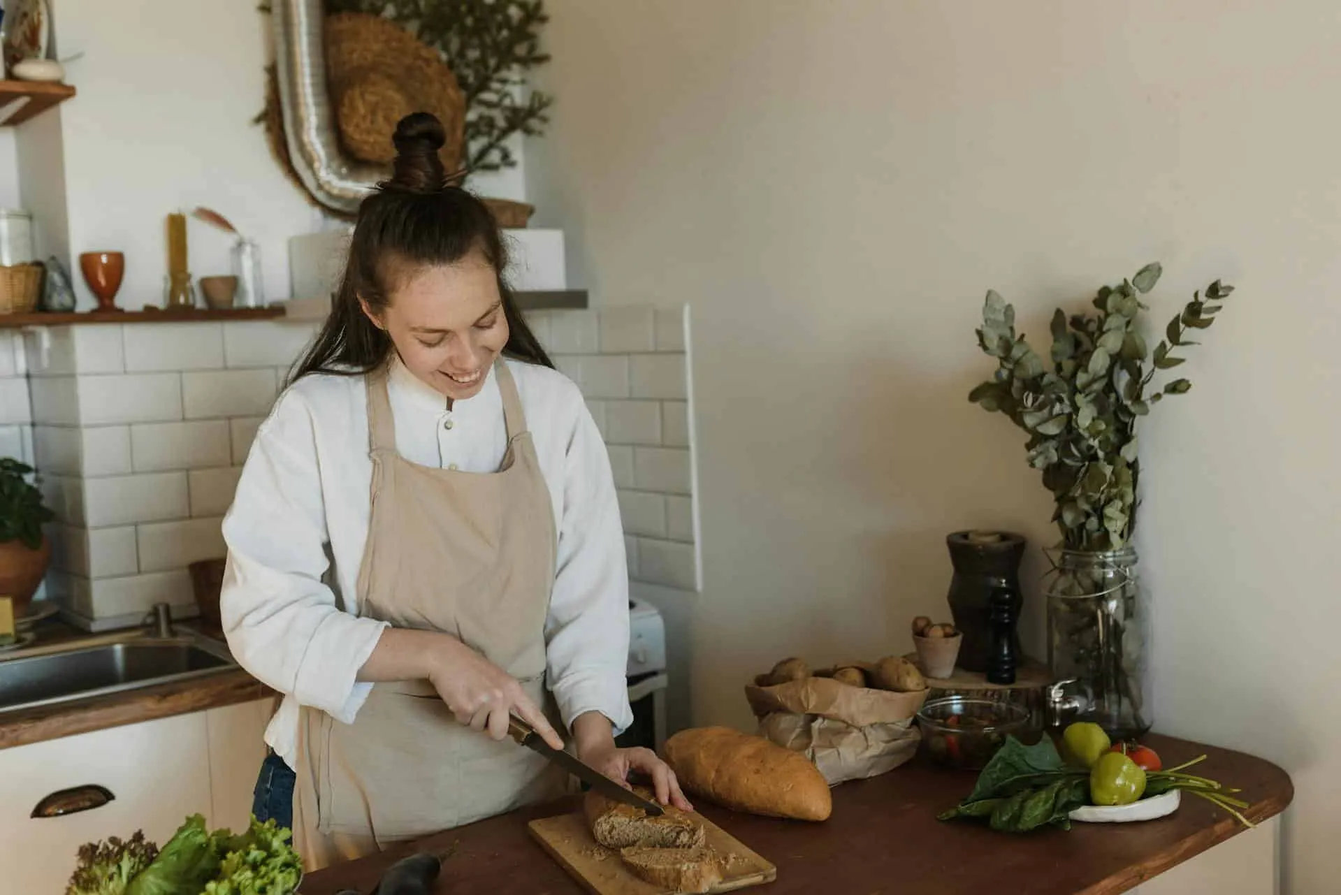 Woman slicing homemade bread